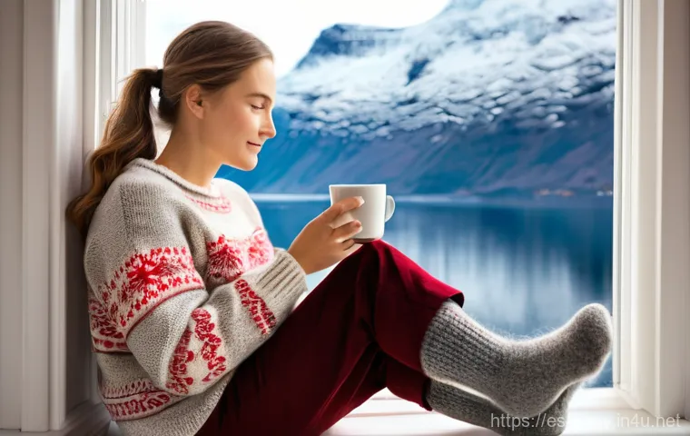 노르웨이에서 꼭 사야 할 기념품 - **A woman, aged 30-40, sits by a large window overlooking a snow-dusted Norwegian fjord, a warm cup ...